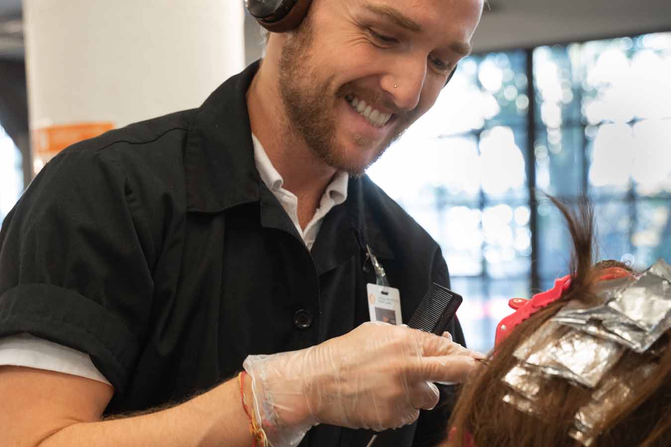 image of student applying color to hair