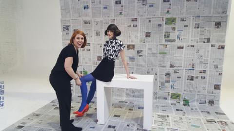 BTS Newsprint Photoshoot 2016 Aveda Institute Portland Director of Education styling model with newspaper backdrop